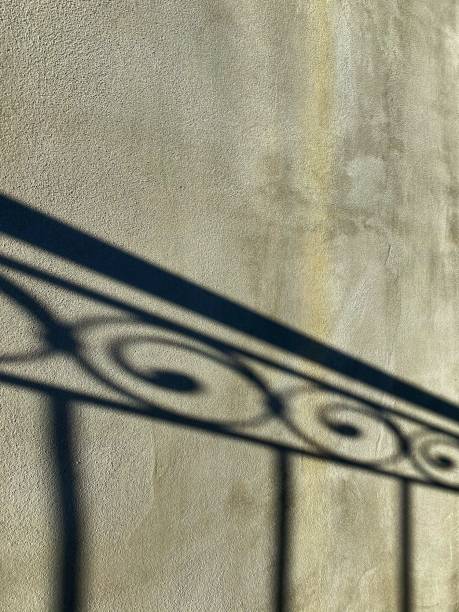 istock shadow of a wrought iron gate 1181456866