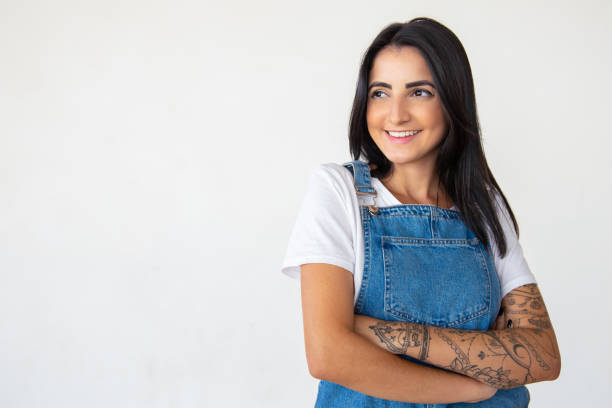 istock Confident young woman with crossed arms 1181457405