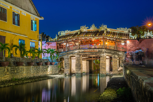 Cau Chua Pagoda, Japanese Covered ancient Bridge and River in Street in Old city of Hoi An in Southeast Asia in Vietnam. Vietnamese heritage and culture in Hoian at night