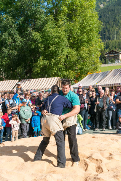Savognin, GR / Switzerland, - 12 October, 2019: two men in the ring during a Swiss wrestling match