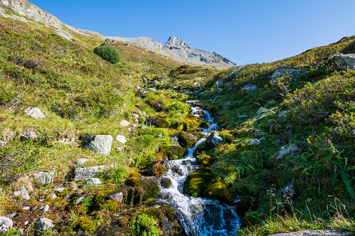 A small creek flowing to the Silvretta reservoir in the Silvretta Alps in Vorarlberg, Austria.