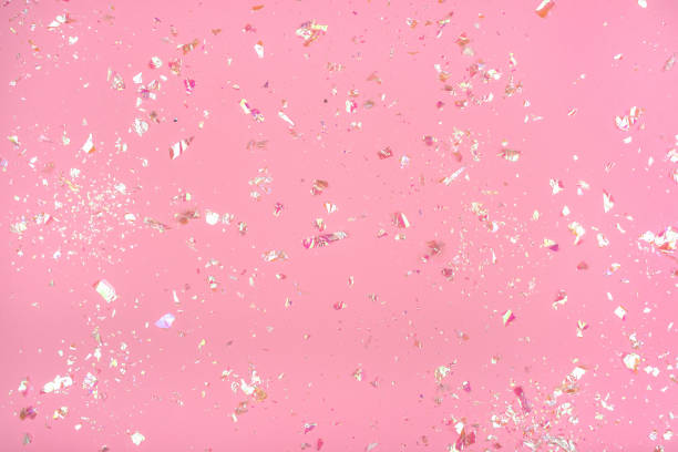 istock Pearl confetti on pink background. 1181462052