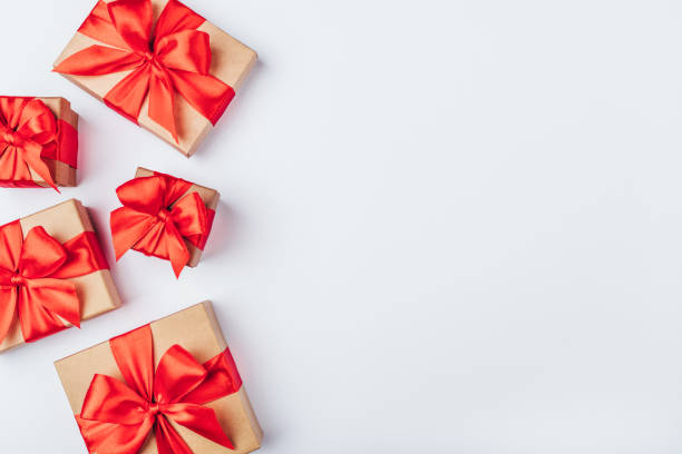 istock Frame of cardboard gift boxes with red bows. 1181463041