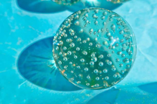 Glassmorphism.Abstract of floating blue and white spheres on a dark background. 3d rendering