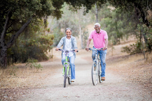 istock Senior African American Couple Riding Bikes 1181465710