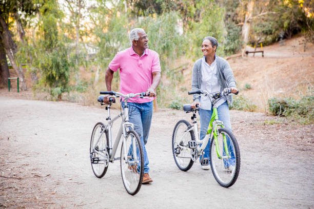 istock Senior African American Couple Riding Bikes 1181465943
