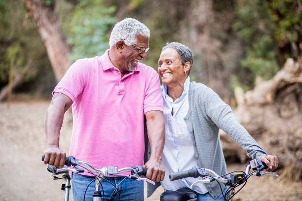 istock Senior African American Couple Riding Bikes 1181465991