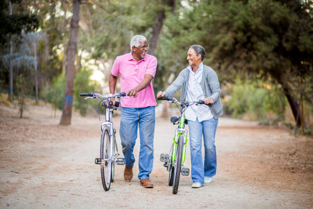 istock Senior African American Couple Riding Bikes 1181466016