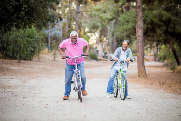 istock Senior African American Couple Riding Bikes 1181466042