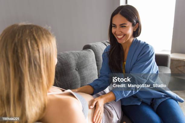 Midwife Examining Expectant Mother Stock Photo - Download Image Now - Midwife, Pregnant, Doula - Healthcare Worker