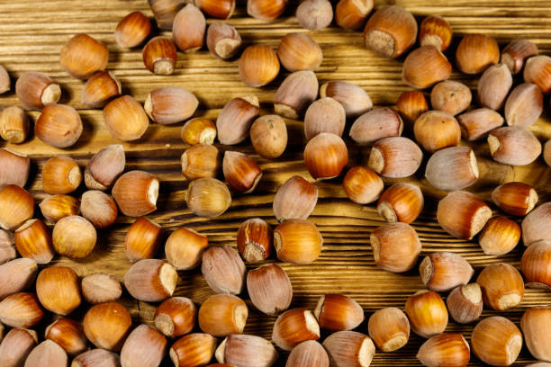 istock Heap of hazelnuts on a wooden table 1181467853