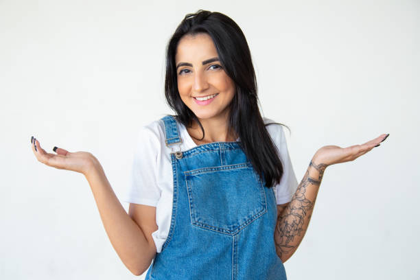 istock Smiling woman with raised hands looking at camera 1181467915