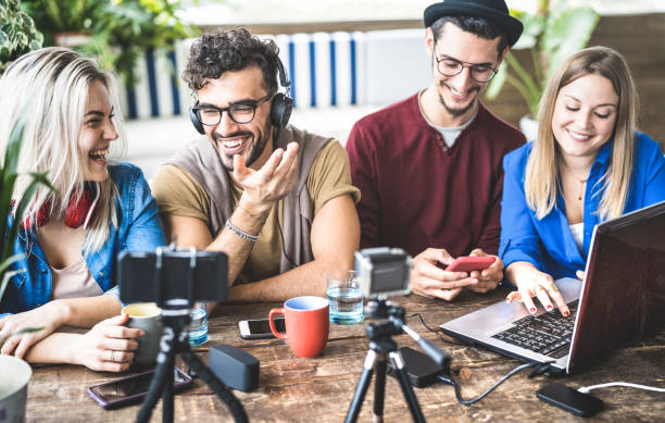istock Young happy friends sharing content on streaming platform with digital web camera - Modern marketing concept with millenial guys and girls having fun vlogging live feeds on social media network 1181468939