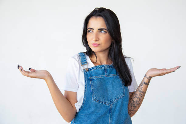 istock Doubting woman with raised hands 1181468982