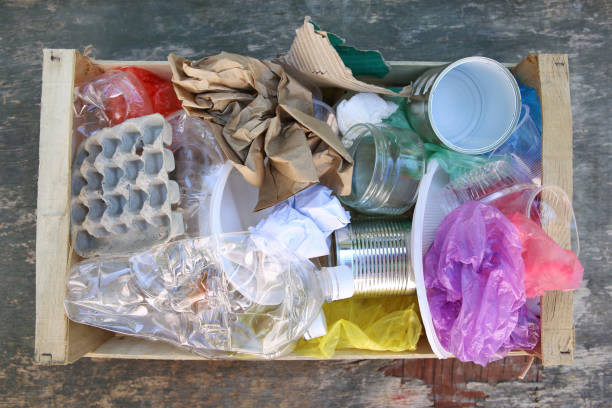 istock Box with trash on wooden background. Top view. Flat lay. 1181469474