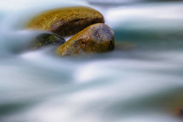 istock Big stones in mountain flowing stream 1181470350