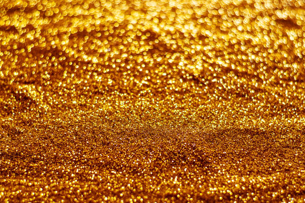 istock Glitter light abstract gold bokeh blurred background 1181470555