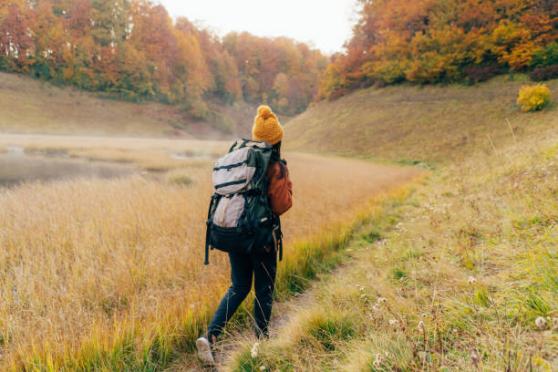 istock woman on a camping trip with a backpack 1181470596