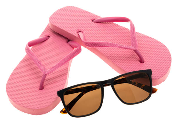 istock Pink flip flops and sunglasses 1181471806