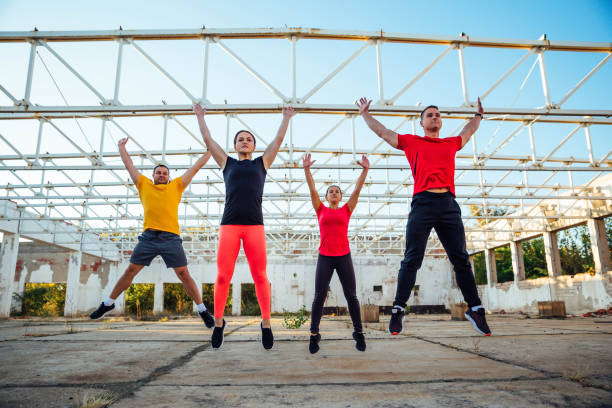 istock Young people jumping during fitness class 1181471848