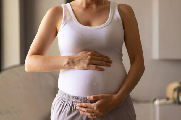 istock Expectant mother standing in at home 1181472042