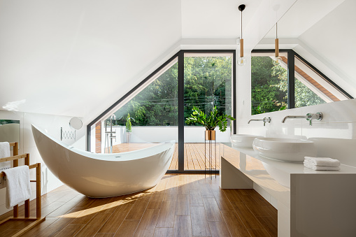 White modern bath in contemporary apartment with stylish loft style interior design, home decor. Soft selective focus.