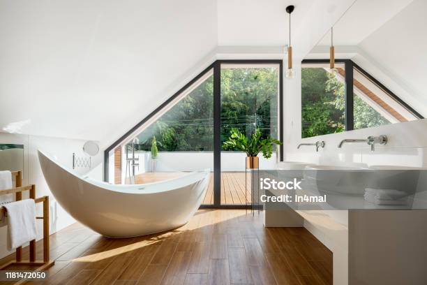Elegant Attic Bathroom With Bathtub Stock Photo - Download Image Now - Domestic Bathroom, Bathroom, Luxury