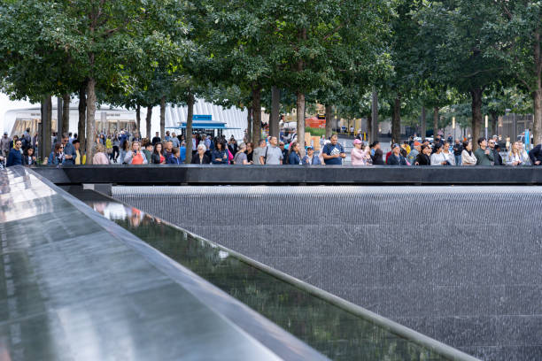 Memorial Pool at Ground Zero in Lower Manhattan, NYC New York, United States of America - September 19, 2019: People standing at the north pool of the World Trade Center Ground Zero Memorial in Lower Manhattan. to the struggle against world terrorism statue photos stock pictures, royalty-free photos & images