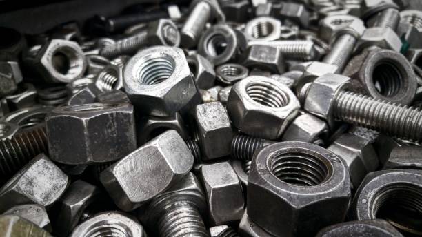 Nuts and screws made of stainless steel metal Stainless steel nut fastener stock pictures, royalty-free photos & images