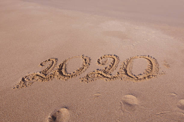 istock Happy New Year 2020 on beach 1181480062