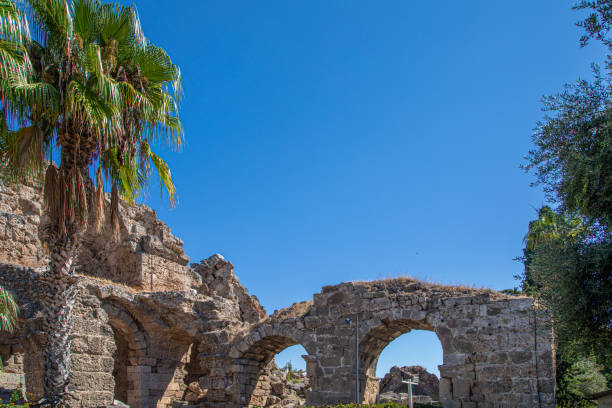 an old historical roman complex with the blue sky in the background