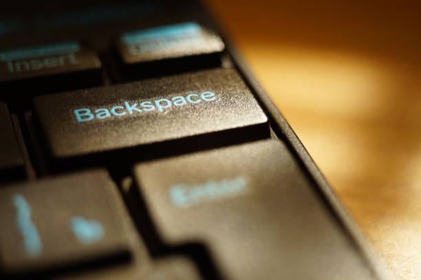 istock black keyboard on the sunny table closeup, selective focus on backspace key 1181483204