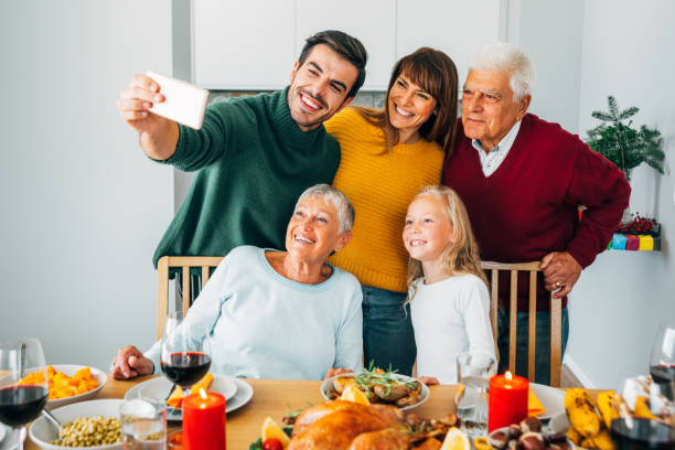 istock Three generation family christmas selfie. 1181484611