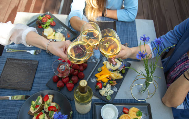 istock Dinner with wine and fruits on wooden table, upper view 1181486168