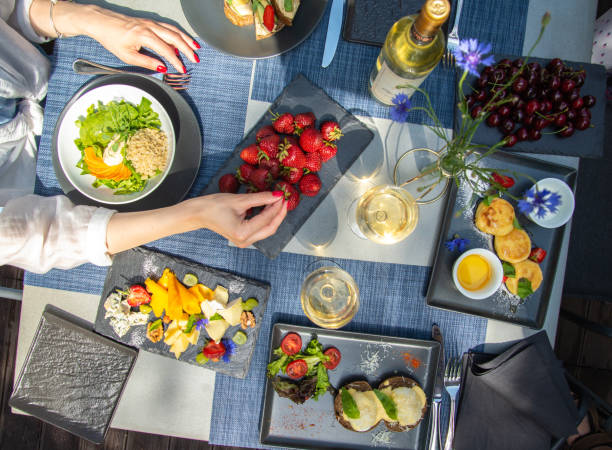istock Dinner with wine and fruits on wooden table, upper view 1181486181