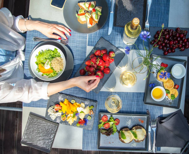 istock Dinner with wine and fruits on wooden table, upper view 1181486203