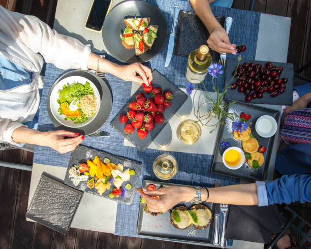 istock Dinner with wine and fruits on wooden table, upper view 1181486219