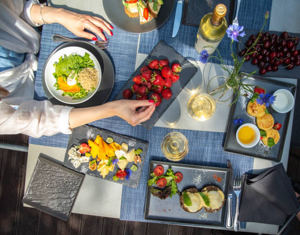 istock Dinner with wine and fruits on wooden table, upper view 1181486238