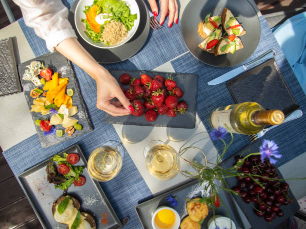 istock Dinner with wine and fruits on wooden table, upper view 1181486256