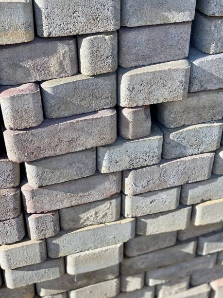 istock Paving slabs. Brick. Construction. Street. Gray tile. Repairs. Mounting. Tile stacker. Construction material. 1181488139