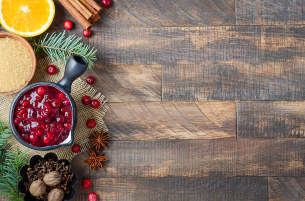 istock Cranberry sauce ingredients on a wooden background. 1181488621