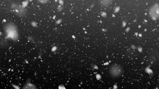 Falling Snowflakes in the Night Falling snow on black background black background stock illustrations
