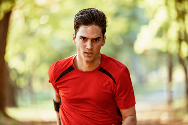 istock Athlete running in the forest 1181492701