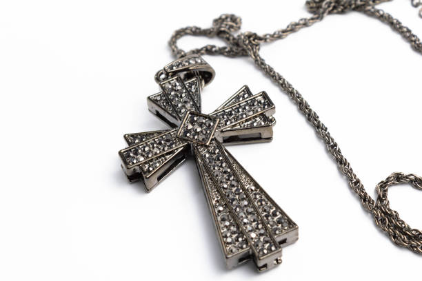 istock Big cross with rhinestones on a white background isolate 1181495377