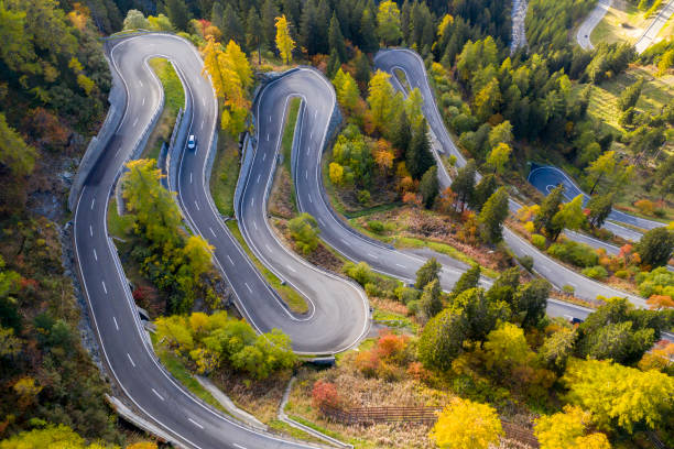 winding mountain road, maloja pass, schweizer alpen - curve driving winding road landscape stock-fotos und bilder