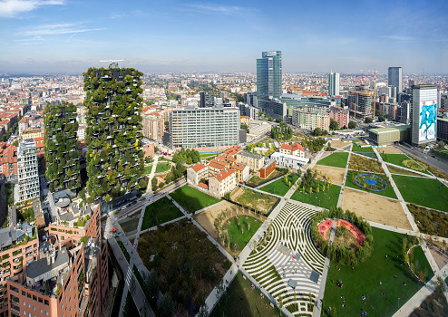 Porta Nuova District, Milan, Italy, October 5, 2019 - Panoramic view on Park Biblioteca degli Alberi (Library of Trees) by architect Petra Blaisse, on the left is the pair of towers Bosco Verticale (Vertical Forest), at the centre is Palazzo Lombardia (Lombardy Building).