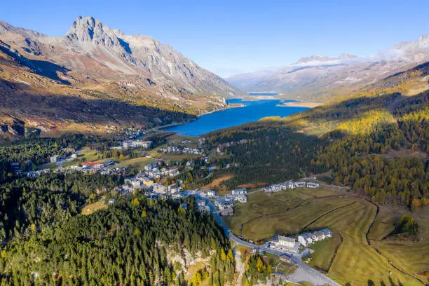 Aerial view of the town/village of Maloja at the summit of the famous Maloja Pass, Silsersee Lake in the background, Graubunden Canton, Switzerland.