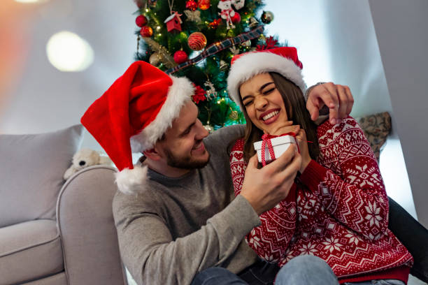 istock Christmas couple with present 1181497296