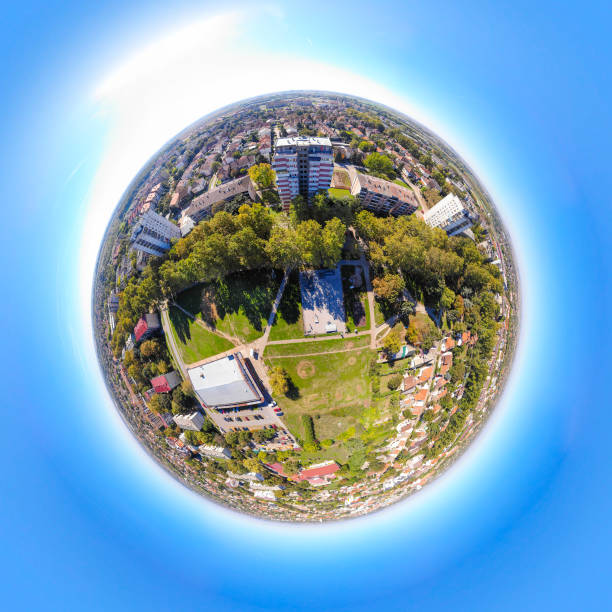 Tiny planet with river and small city stock photo stock photo