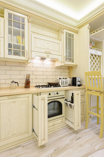 istock Luxury modern beige kitchen closeup, some drawers open 1181500766